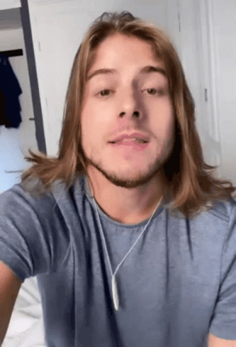 Man With Long Hair Wearing Blue Shirt GIF