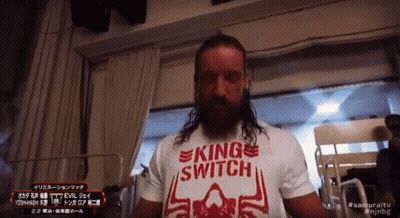 A Man With Long Hair Is Wearing A King Switch T-Shirt GIF