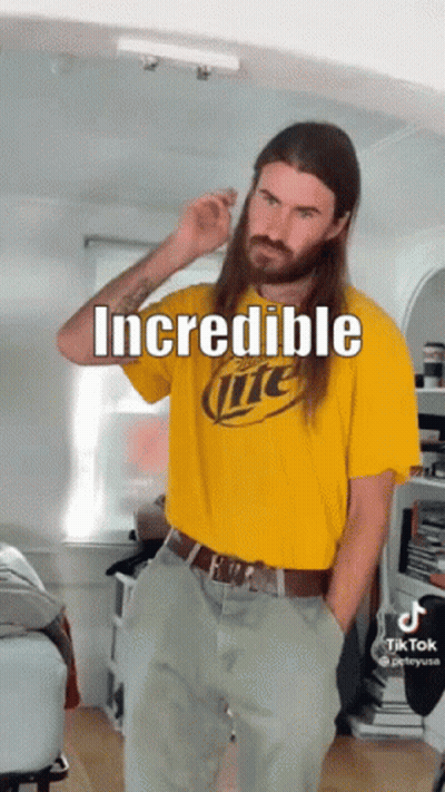 A Man With Long Hair Is Wearing A Miller Lite T-Shirt GIF