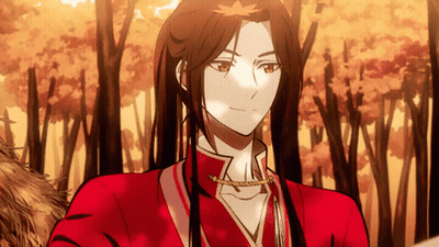 A Man With Long Hair Is Wearing A Red Shirt GIF