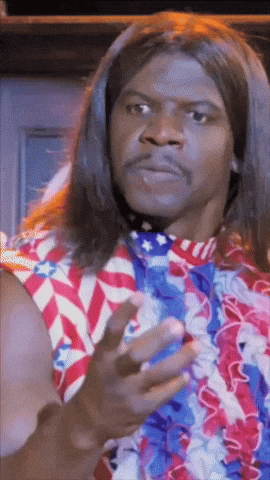 A Man With Long Hair Is Wearing A Red White And Blue Shirt And Tie GIF