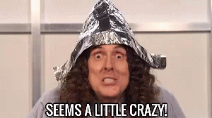 A Man With Long Hair Is Wearing A Tin Foil Hat And Says `` Seems A Little Crazy '' . GIF