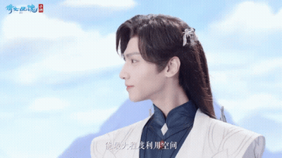A Man With Long Hair Is Wearing A White Jacket GIF