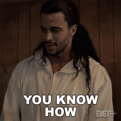 A Man With Long Hair Is Wearing A White Jacket That Says You Know How GIF