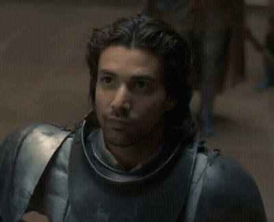 A Man With Long Hair Is Wearing Armor GIF