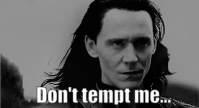 A Man With Long Hair Says " Don 'T Tempt Me " In A Black And White Photo GIF