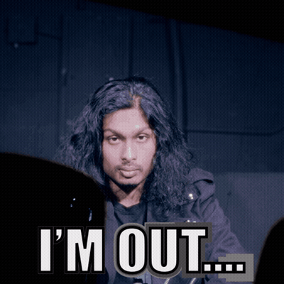 A Man With Long Hair Says I 'M Out In Front Of A Dark Background GIF