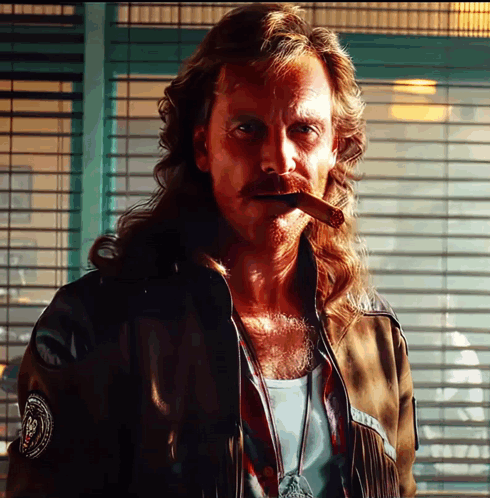 A Man With Long Hair Smoking A Cigar With A Patch On His Jacket That Says ' N.p.d. ' GIF
