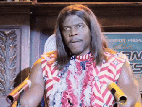 A Man With Long Hair Stands In Front Of A Sign That Says Security Preps GIF