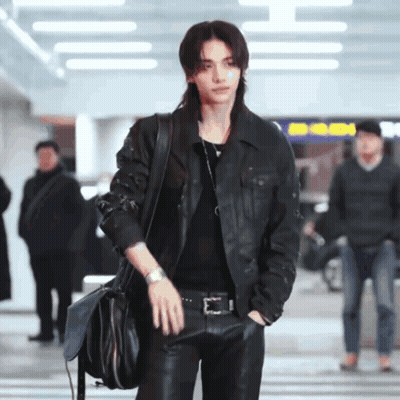 A Man With Long Hair Wearing A Leather Jacket GIF