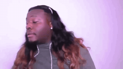 A Man With Long Hair Wearing Headphones And A Headband . GIF