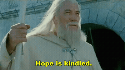 A Man With Long White Hair And A Beard Says Hope Is Kindled In Yellow Letters GIF