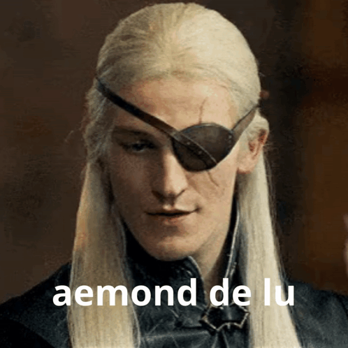A Man With Long White Hair And A Patch On His Eye Has The Word Aemond De Lu On The Bottom GIF