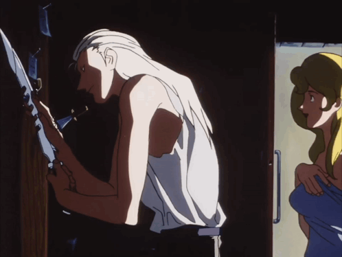 A Man With Long White Hair Is Standing Next To A Woman In A Blue Shirt GIF