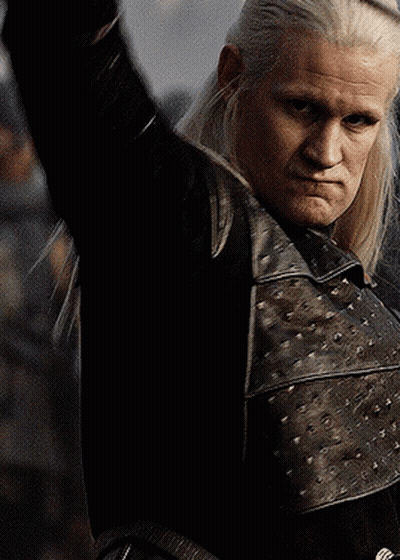 A Man With Long White Hair Is Wearing A Black Leather Jacket GIF