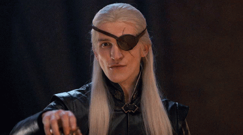 A Man With Long White Hair Wearing A Black Eye Patch GIF