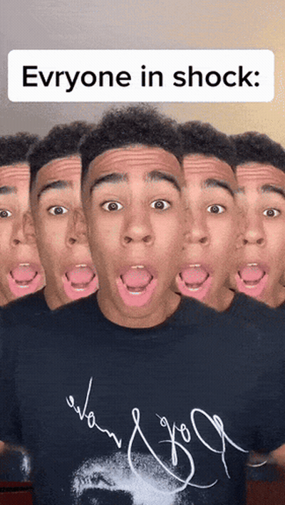 A Man With Many Faces And The Words " Everyone In Shock " Above Him GIF