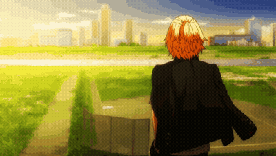 a man with orange hair is standing in a field