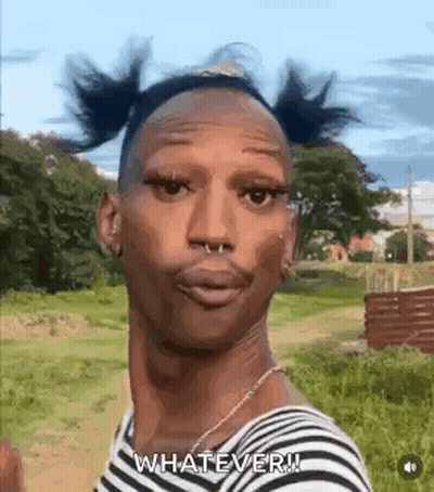 A Man With Pigtails And A Nose Ring Is Standing In A Field And Making A Funny Face . GIF