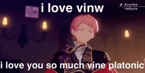 A Man With Pink Hair Is Standing In A Room With Candles And A Caption That Says `` I Love Vinw '' . GIF