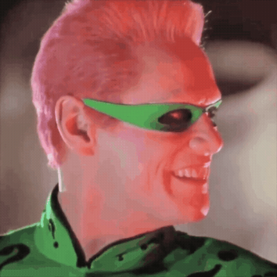 A Man With Pink Hair Wearing Green Sunglasses And A Green Shirt GIF
