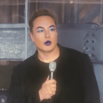 A Man With Purple Eyebrows Is Holding A Microphone In His Hand GIF
