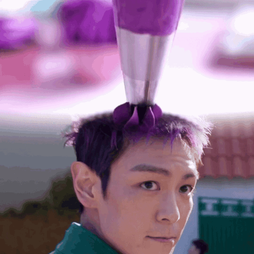 A Man With Purple Hair Has A Purple Bag On His Head GIF