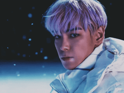 A Man With Purple Hair Is Wearing A White Jacket With The Word Copycat On It GIF