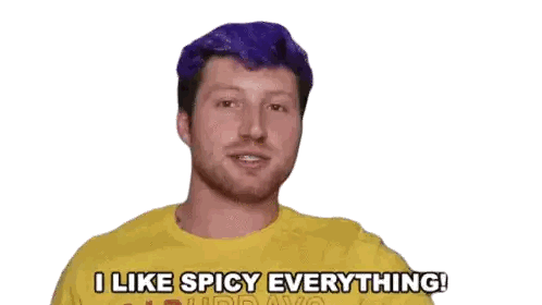 A Man With Purple Hair Is Wearing A Yellow Shirt And Says I Like Spicy Everything Sticker