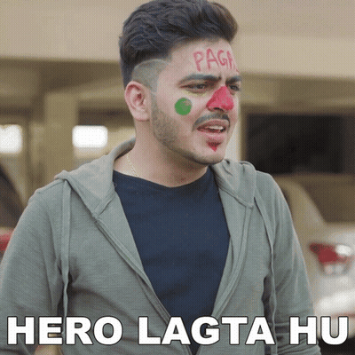 A Man With Red And Green Paint On His Face Has The Words Hero Lagta Hu Written Below Him GIF
