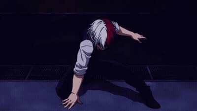 a man with red and white hair is laying on the ground