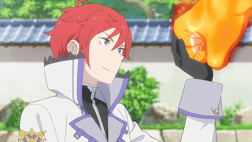 A Man With Red Hair And Blue Eyes Is Holding A Large Orange Object In His Hand GIF