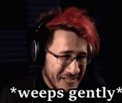 A Man With Red Hair And Glasses Is Wearing Headphones And Says `` Weeps Gently '' GIF