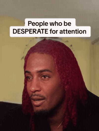 A Man With Red Hair Has A Sticker On His Face That Says People Who Be Desperate For Attention GIF