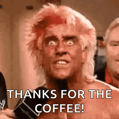 A Man With Red Hair Is Holding A Microphone And Says Thanks For The Coffee . GIF