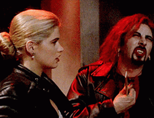 Red Haired Man Smoking Cigarette Watching Woman GIF