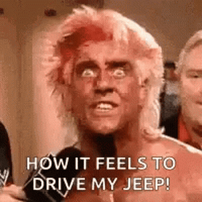 A Man With Red Hair Is Talking About How It Feels To Drive His Jeep . GIF