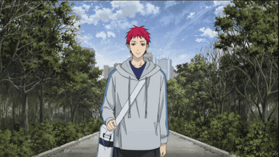 A Man With Red Hair Is Walking Down A Path In A Park GIF