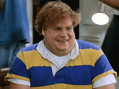 A Man With Red Hair Is Wearing A Blue And Yellow Striped Shirt . GIF