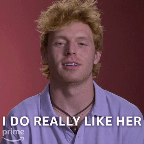 A Man With Red Hair Says " I Do Really Like Her " In Front Of A Red Background GIF