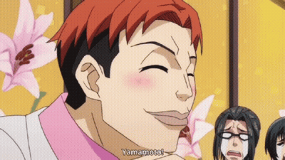 A Man With Red Hair Says Yamamoto In Front Of Some Flowers GIF