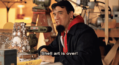 A Man With Shell Art Is Over Written On His Shirt GIF