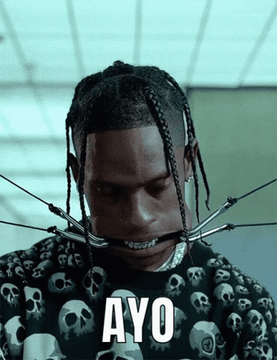 A Man With Skulls On His Shirt Has The Word Ayo Written On His Face GIF
