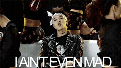 A Man With Spikes On His Jacket Is Surrounded By Women And The Words Iain 'T Even Mad GIF