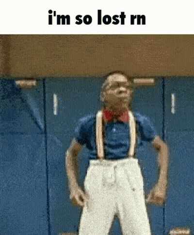 A Man With Suspenders And A Bow Tie Is Standing In Front Of Blue Lockers And Says I 'M So Lost Rn GIF