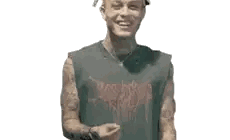 A Man With Tattoos On His Arms Is Smiling And Wearing A Tank Top . Sticker