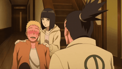 A Man With The Letter D On His Back Is Standing Next To A Woman GIF