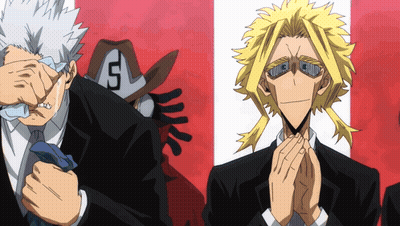 A Man With The Letter S On His Hat Is Standing Next To Another Man GIF