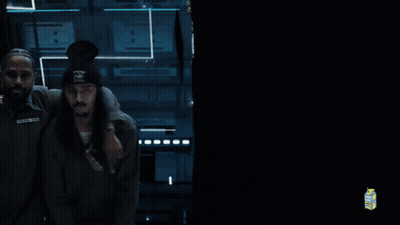A Man With The Name Black On His Shirt Is Being Held GIF
