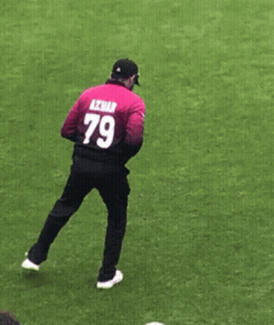 A Man With The Number 79 On His Back Is Standing On One Leg GIF